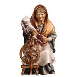 Woman at spinning wheel :...